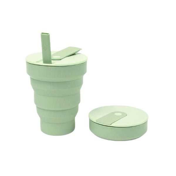Collapsible cup 16oz shown in sage green up with flexible straw alongside collapsed
