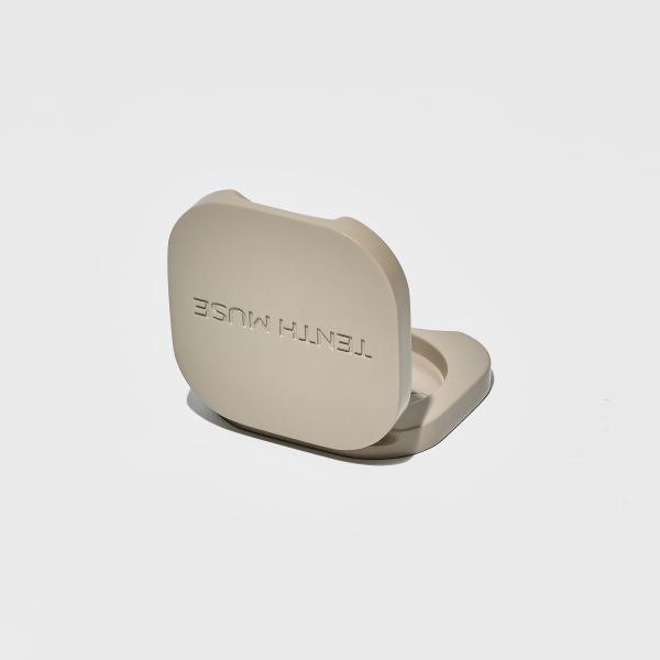 Clay vessel shown open with 'Tenth Muse' engraved on lid
