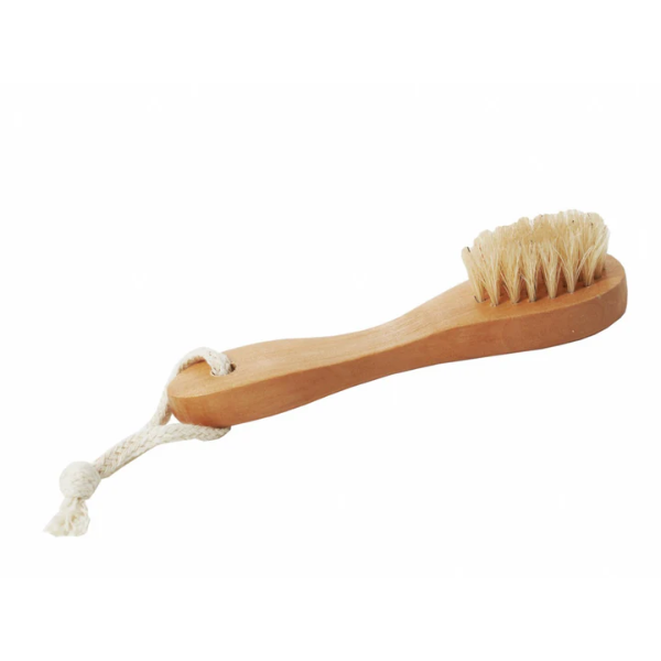 Natural exfoliating face brush with wooden handle and cotton hanging loop