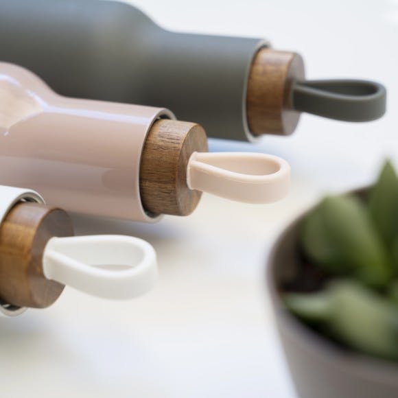 Reusable water bottles shown close up at the lid