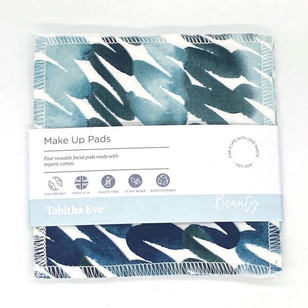 Reusable make up pad in Teal swirl design (white background with different shades of teal and blue swirling), shown with paper label reading 'Make Up pads, Four reusable facial pads made with organic cotton'