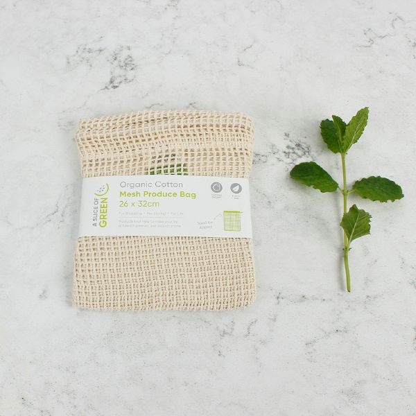 Mesh produce bag with paper label on a marble surface