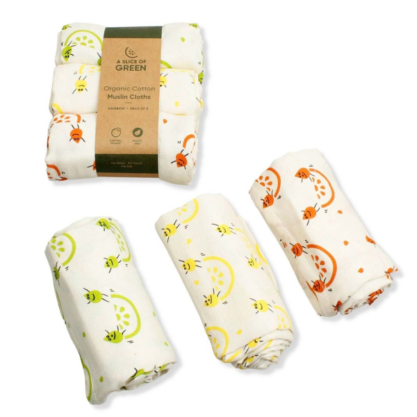 Organic cotton set of three muslin cloths, shown both as the set with paper wrapper, and as three separate cloths rolled up. All with cream background with colourful fruity images.