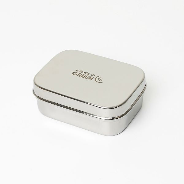 Travel soap or snack tin with lid shown on. Lid has logo reading A Slice of Green.