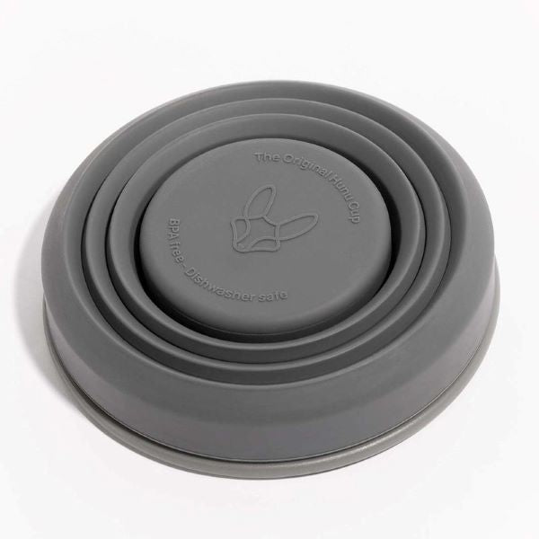 Collapsible cup shown in charcoal collapsed
