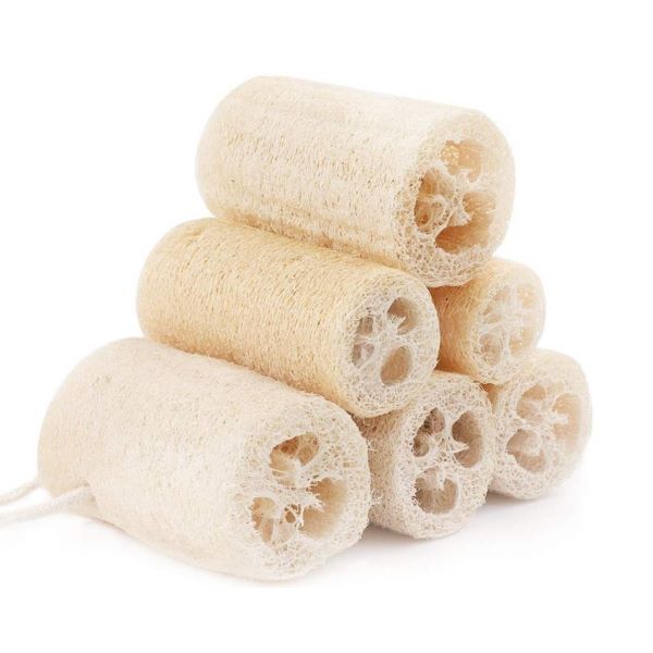 Natural loofahs arranged in a pyramid pattern