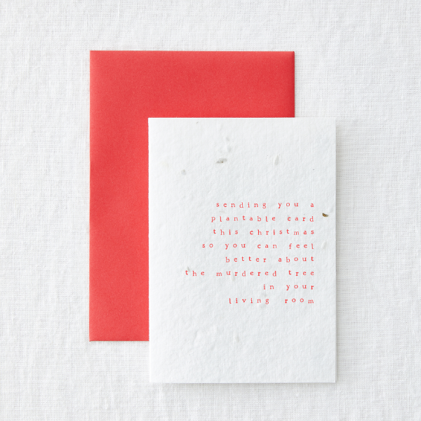 Christmas card saying 'sending you a plantable card this Christmas so that you can feel better about the murdered tree in your living room'