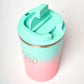 Neon Kactus insulated cup in Twist and shout colour - pink at bottom, graduating to a turquoise, shown with lid on