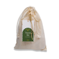 Moonie sustainable travel kit cotton bag with paper label saying "Zero waste travel kit 10 eco essentials"