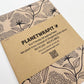 Planet Wrapit eco-friendly kraft wrapping paper with black floral design and PlanetWrapIt paper label.
