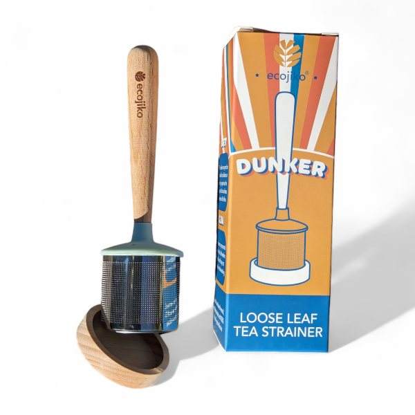 Loose leaf tea strainer with wooden handle and plastic-free packaging on a white background