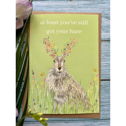 Eco birthday card, lime background with a hare and the words "at least you've still got your hare"