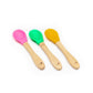 Bamboo and silicone baby weaning spoons in pink, green and yellow