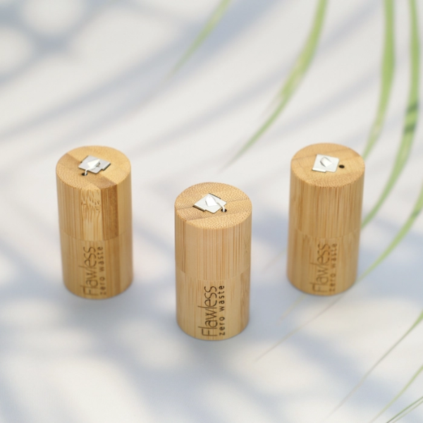 Three bamboo floss containers showing cutting mechanism at top of lid