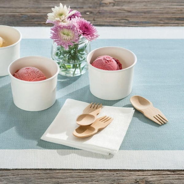 Bamboo spork shown on a table next to bowls of ice cream