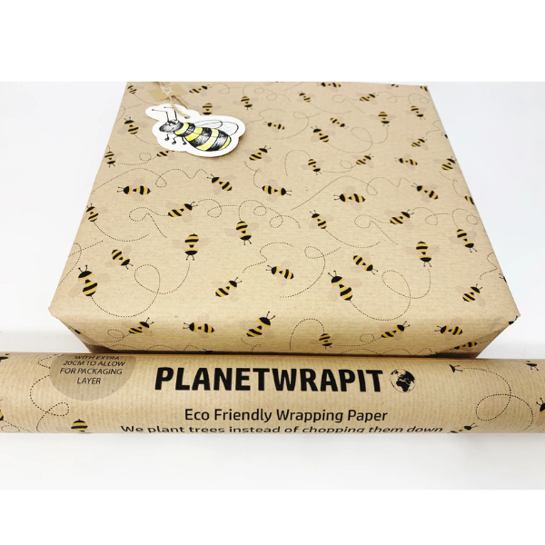 Eco-friendly recyclable wrapping paper in bees design (brown paper with little bees flying around) shown as a wrapped parcel