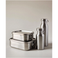 Eco-friendly lunchbox stainless steel bento box, double layer with smaller box on top of the larger, alongside stainless steel reusable bottles