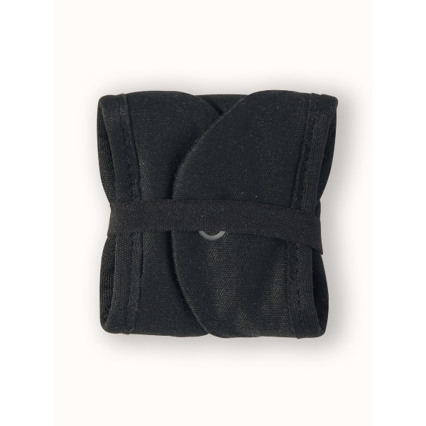 Reusable period pad in black, liner, folded over showing loop to keep secure