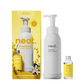 Neat body wash and refill set in Mimosa blossom and neroli showing the refillable aluminium bottle next to concentrated glass bottle refill