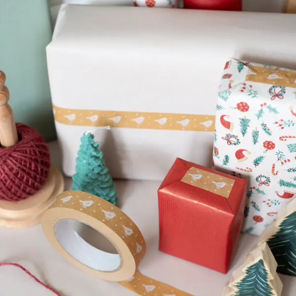 Christmas paper tape brown with white robins shown on roll next to wrapped parcels with the tape attached