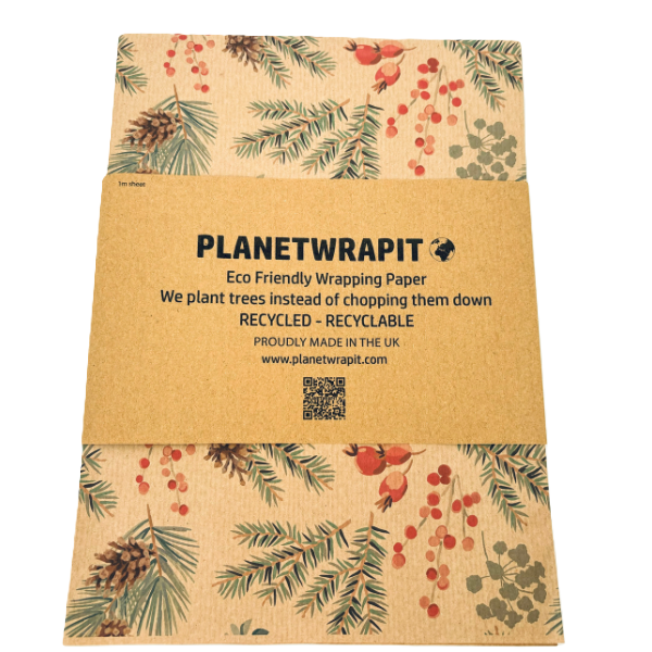 Handmade recycled wrapping paper in Christmas Pine Trees design (brown kraft paper with pine leaves and berries) shown wrapped in paper label