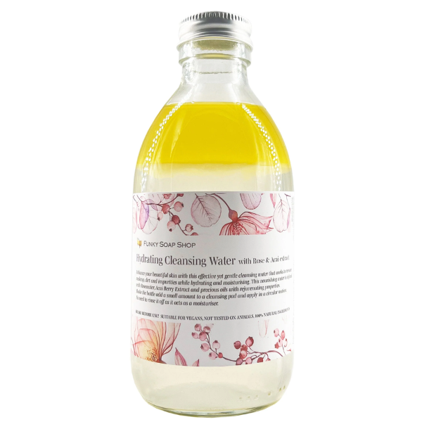 Cleansing water with rose and acai in a glass bottle
