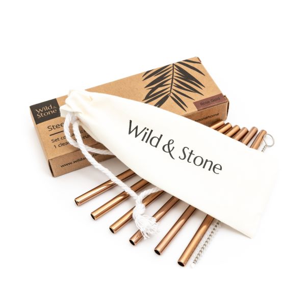 Steel cocktail straw set in rose gold alongside cotton pouch and straw cleaning brush