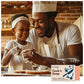 A man and child with apron and chef's hat baking with dusty hands and large smiles