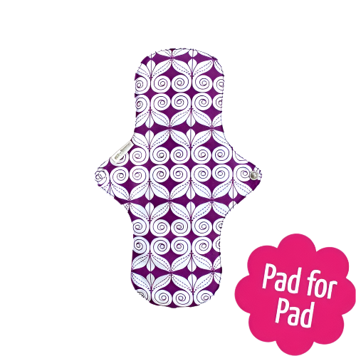 Eco Femme natural organic period day pad plus, showing purple and white swirl pattern bottom layer