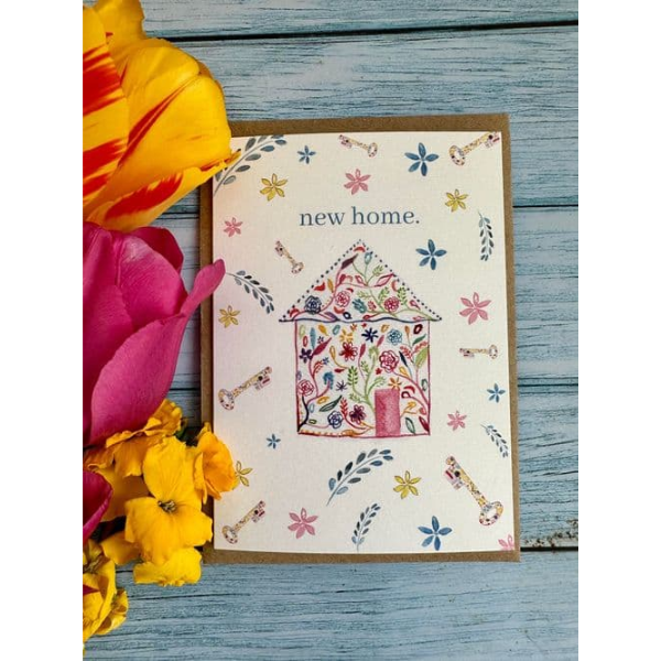 Eco-friendly card by eco artist Jen Winnett reading "new home" with a watercolour, flowery house, with bright keys