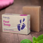 Friendly Soap foot soap bar shown alongside its cardboard box packaging and some fresh mint