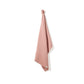 Knitted cotton hand towel in Rose pink shown hanging up