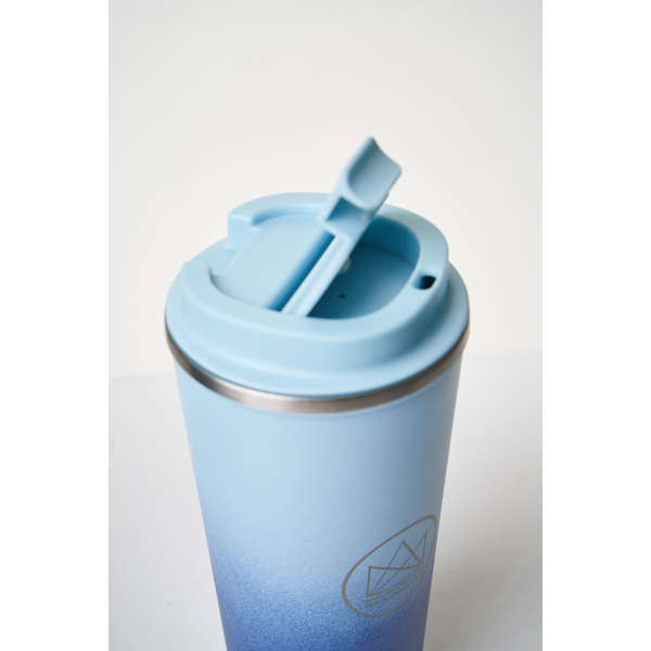 Insulated travel cup close up with sipping lid, in Good vibrations colourway (bright blue at bottom graduating to light blue at top)