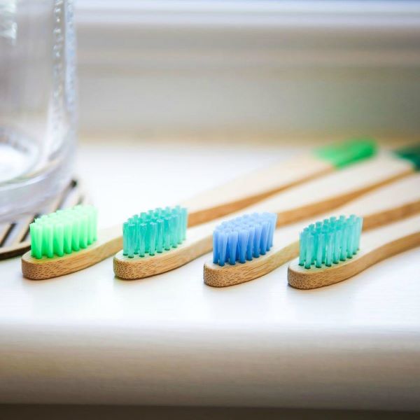 Kids bamboo toothbrush set, pack of 4 in aqua colourways (blues and greens)