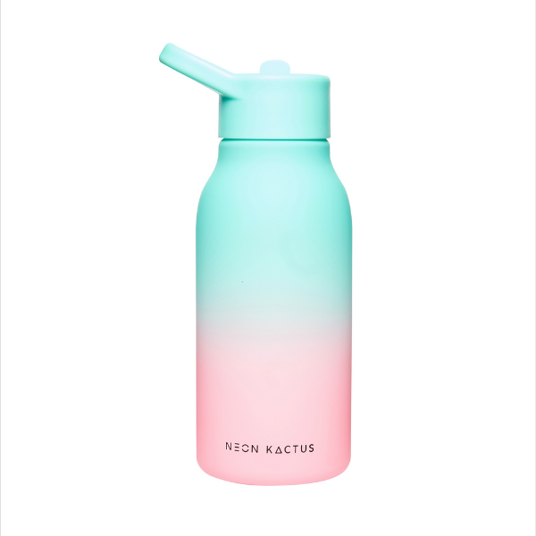 Kids reusable tritan bottle in Twist and Shout (pink at bottom graduating to mint green at the top) shown with lid on