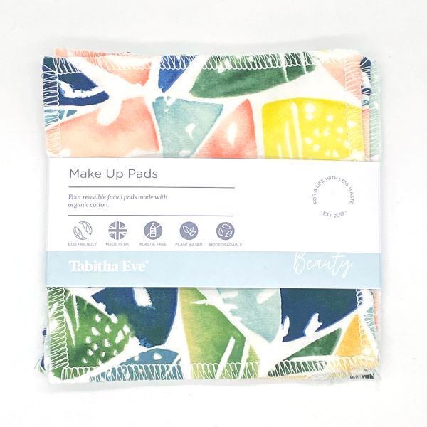 Reusable make up pad in Bright leaves design  ((geometric colourful leaves design), shown with paper label reading 'Make Up pads, Four reusable facial pads made with organic cotton' 