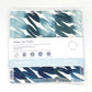 Reusable make up pad in Teal swirl design  (white background with different shades of teal and blue swirling), shown with paper label reading 'Make Up pads, Four reusable facial pads made with organic cotton' 