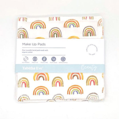 Reusable make up pad in Rainbows design (white background with small painted rainbows), shown with paper label reading 'Make Up pads, Four reusable facial pads made with organic cotton'