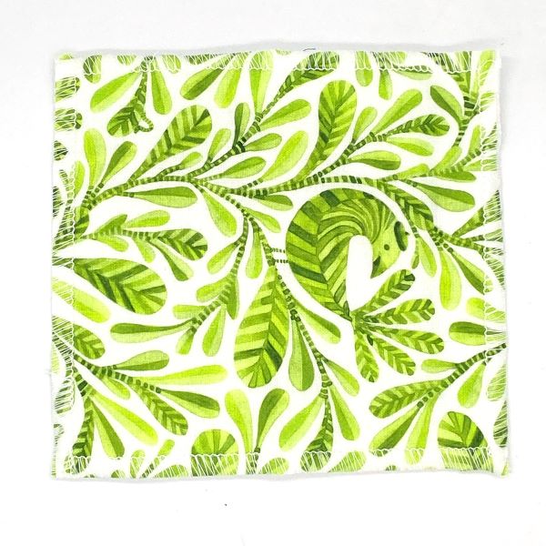 Reusable make up pad in Jungle leaf design (white background with bright green leaves)