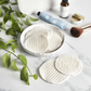 Organic cotton makeup rounds in a dish
