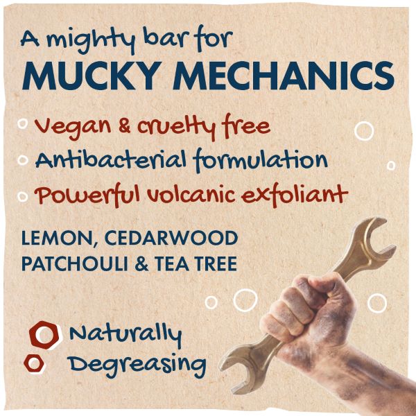 A hand holding a spanner with text reading "A mighty bar for mucky mechanics; vegan and cruelty-free, antibacterial formulation, powerful volcanic exfoliant; lemon, cedarwood patchouli and tea tree; naturally degreasing."