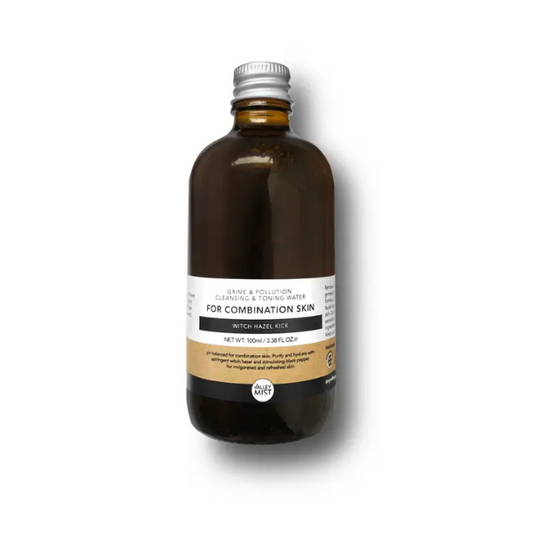 Men's micellar water and toner in dark brown glass bottle with aluminium lid on a white background 