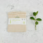 Mesh produce bag with paper label on a marble surface