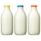 Moopops silicone milk bottle lids shown on top of three milk bottles