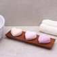 Naseberry wood three bay soapdish holding three small, colourful bath bombs