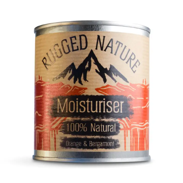 Rugged Nature natural moisturiser in recyclable tin with label reading "Moisturiser 100% natural, Orange and bergamot"