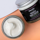 Nourish night cream in glass jar shown with lid off and cream inside