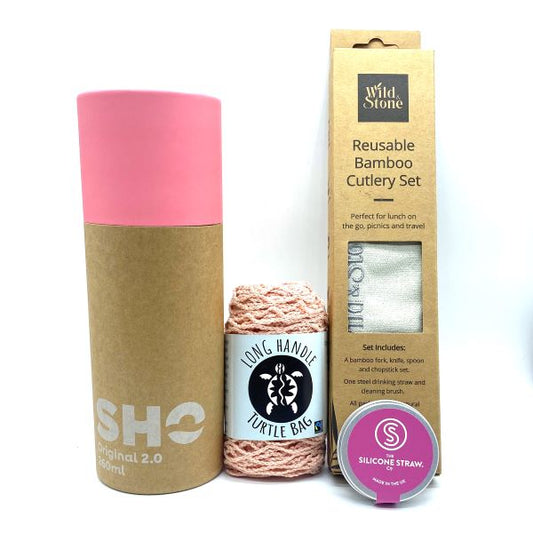 The individual items in the eco-friendly gift set for out and about in pink