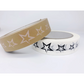 Eco-friendly paper tape brown kraft with silver stars alongside white paper tape with black stars