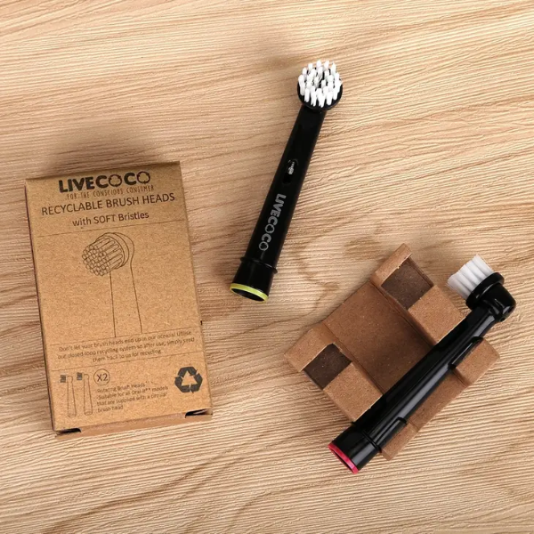 Two Live Coco recyclable electric toothbrush junior heads shown side by side with cardboard packaging